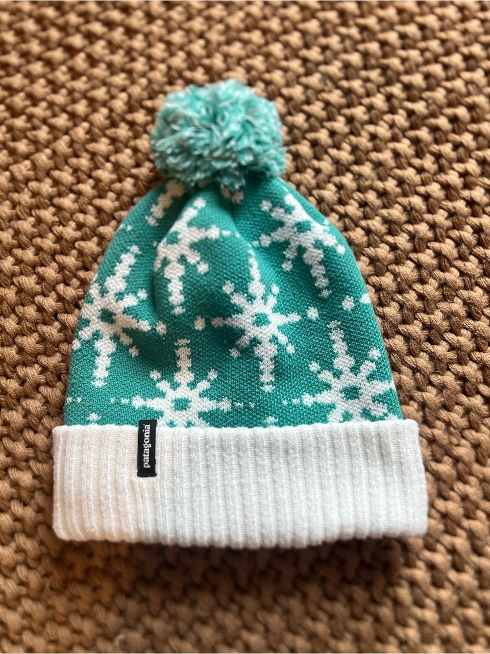 Patagonia Teal Snowflake Pom Beanie with White Cuff
